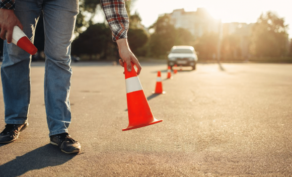 Instructor Sets Cone for Driving Session